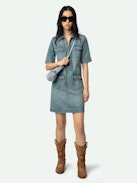 Record Denim Dress - Short military-inspired denim dress with short sleeves, laced neckline, and multiple pockets.