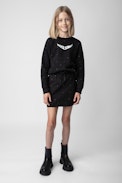 Alice Girls’ Skirt - Girls’ black cotton fleece skirt with diamanté and wings motif on the back.
