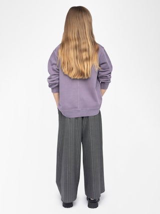 Sweatshirt Girl's Damson - Wide and long fleece sweatshirt with rhinestone wing on front surrounded by "rain" rhinestones.