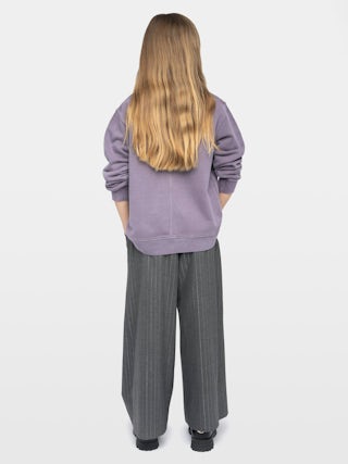 Sweatshirt Girl's Damson - Wide and long fleece sweatshirt with rhinestone wing on front surrounded by "rain" rhinestones.