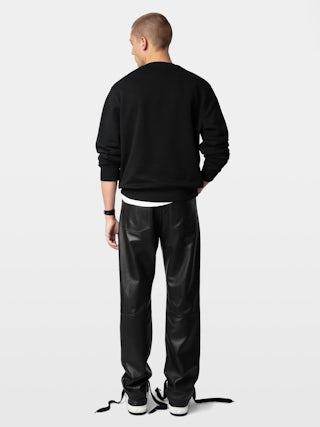 Sweatshirt Aime - Sweatshirt molletonné en coton biologique noir à manches longues et broderie "Rock'N'Roll Is Not Dead".