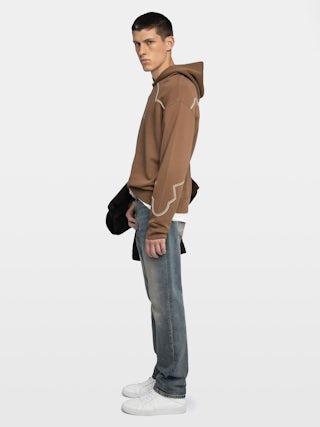 Sweeny Sweatshirt - Long-sleeved hooded sweatshirt with western cutouts.