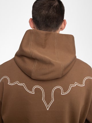 Sweeny Sweatshirt - Long-sleeved hooded sweatshirt with western cutouts.