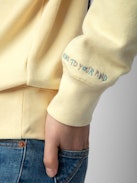 Jumper Upper - Light yellow long-sleeved sweatshirt with insignia and customised details designed by Humberto Cruz.
