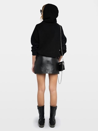 Sudadera Georgy - Sudadera negra oversized con capucha, alas ZV de estrás en la parte delantera y mensaje oculto "Be Kind To Your Mind" en la manga.