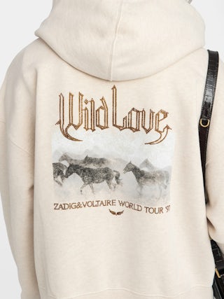 Sweatshirt Mia - Sweatshirt à capuche fermeture zippée avec imprimé et strass au dos.