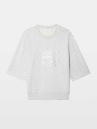 Sudadera Edmond - Sudadera de manga 3/4 con pedrería en la parte delantera.