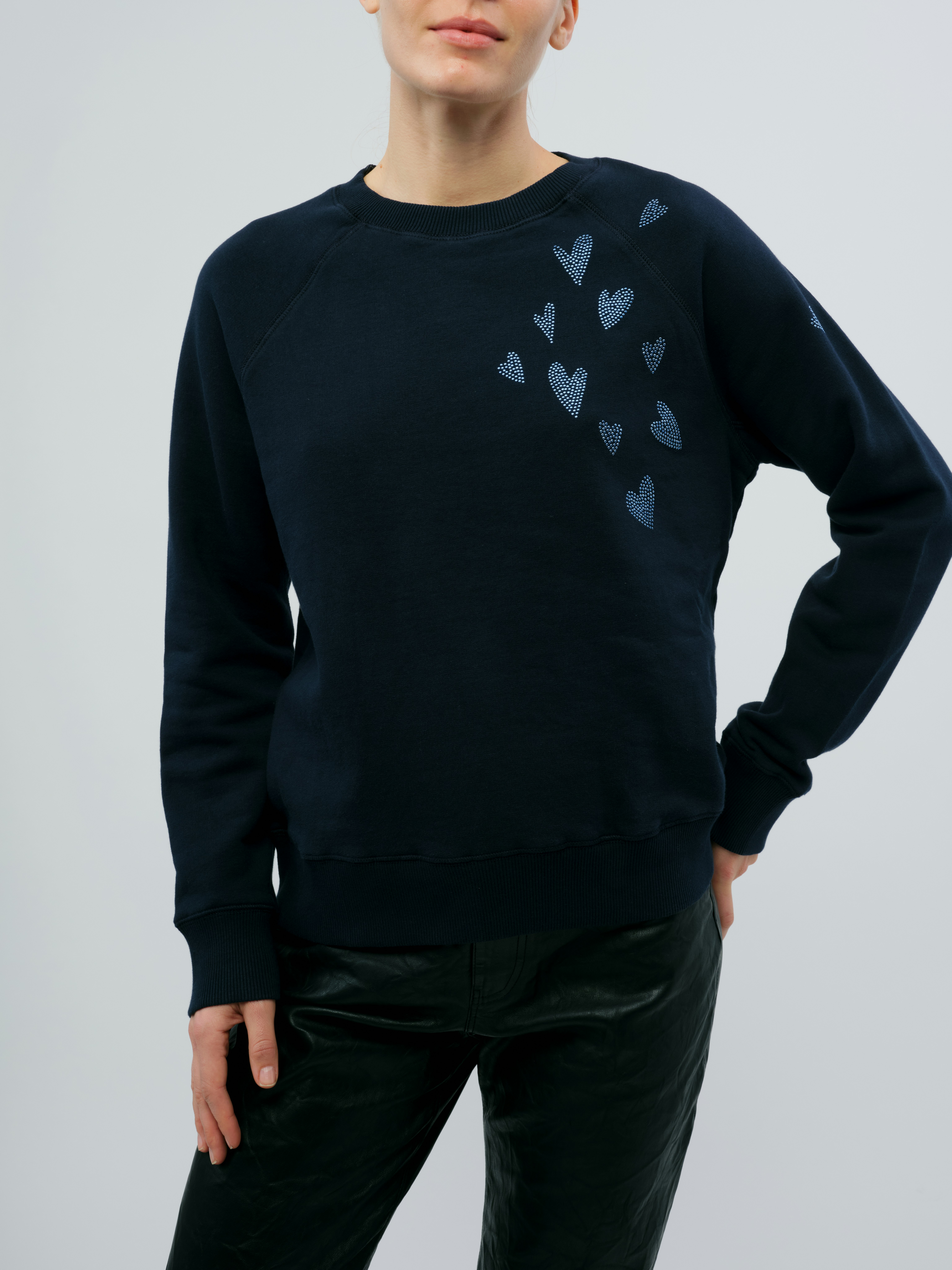 Upper Rain Heart Sweatshirt - Cozy sweatshirt with a small heart graphic.