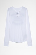 Camiseta Tunisien Blason - Camiseta de mujer de algodón blanco y cuello tunecino con escudo de strass en la espalda. Confeccionado con fibras procedentes de la agricultura ecológica.