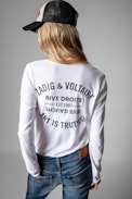 Camiseta Tunisien Blason - Camiseta de mujer de algodón blanco y cuello tunecino con escudo de strass en la espalda. Confeccionado con fibras procedentes de la agricultura ecológica.
