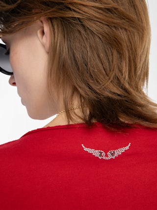 Tuni Henley T-shirt - Short-sleeved Henley T-shirt with rhinestone wings on back.