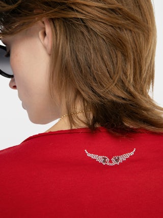 Tuni Henley T-shirt - Short-sleeved Henley T-shirt with rhinestone wings on back.