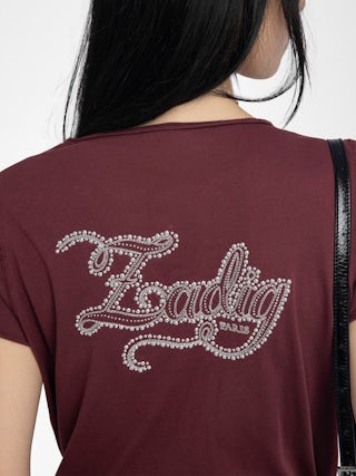 Henley T-Shirt - Henley T-shirt with short sleeves featuring embroidery and rhinestones on the back.