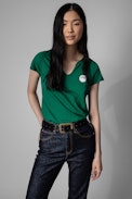 Multicusto Henley T-shirt - Girls can do anything women's green cotton Henley T-shirt. This product is GOTS certified and made with fibers from organic farming.