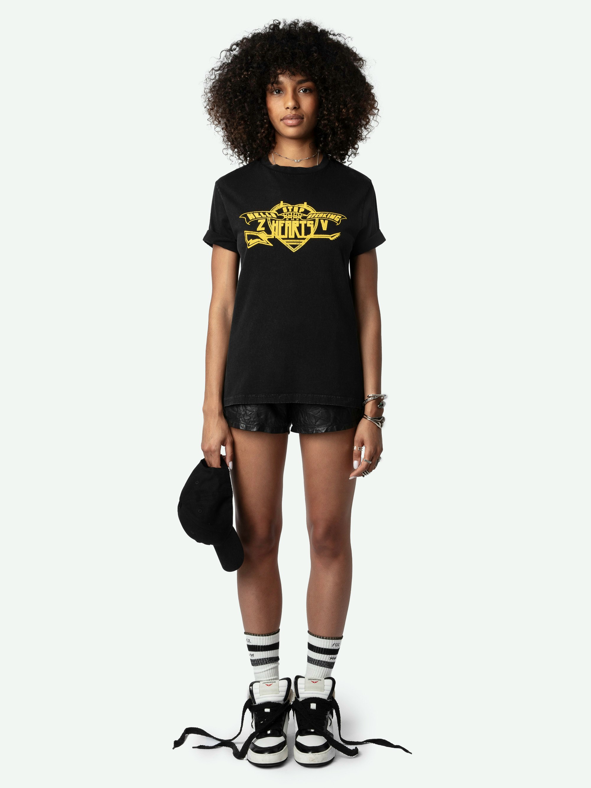 Edwin Hearts T-shirt - Short-sleeved, oversized black organic cotton T-shirt with "Hello Stop Breaking Hearts" flocked on front.