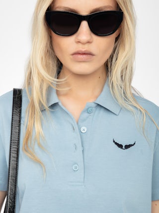 Mirta Cropped Polo Shirt - Short-sleeved cropped polo with embroidered wings on the front.