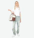 Mirta Polo - Short-sleeved cropped polo with embroidered wings on the front.