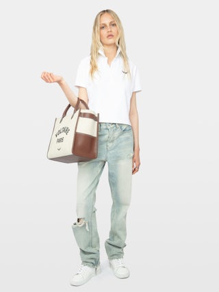 Mirta Cropped Polo Shirt - Short-sleeved cropped polo with embroidered wings on the front.