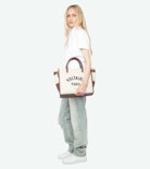 Mirta Polo - Short-sleeved cropped polo with embroidered wings on the front.