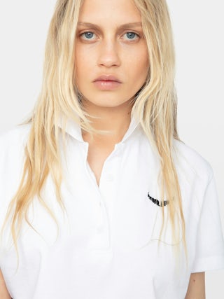 Mirta Cropped Polo Shirt - Short-sleeved cropped polo with embroidered wings on the front.