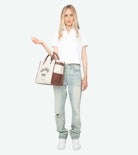 Mirta Polo - Short-sleeved cropped polo with embroidered wings on the front.