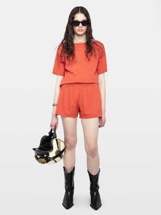 Ella T-shirt - Short-sleeved T-shirt with open back and drawstring with wing charms.