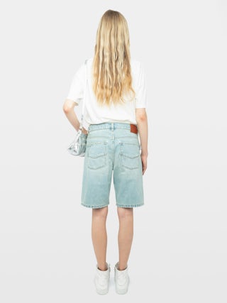 Camiseta Edda - Camiseta asimétrica de manga corta con pedrería en la parte delantera.