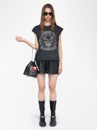 Canottiera Cloe - T-shirt senza maniche con strass sul davanti.