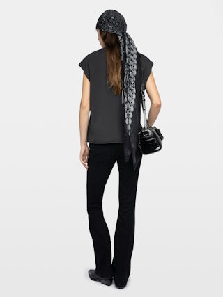 Cloe Tank Top - Sleeveless round neck t-shirt with print and small holes on the front.