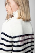 Almia Girls’ Dress - Girls’ beige knit turtleneck dress with stripes and diamanté “Voltaire” branding.