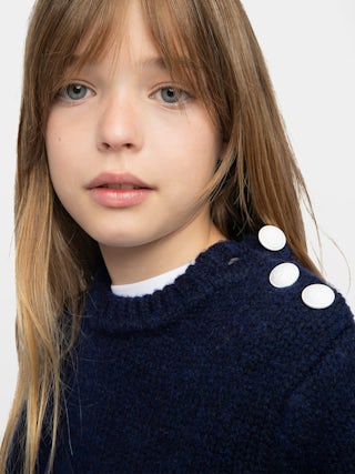Malta Girl's Jumper - Wool jumper, round neck and buttoned opening on the shoulder, fancy logo embroidered on the sleeve.