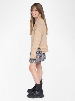 Alma Girls' Jumper - Wool jumper with high neck, shoulder button fastening, wing embroidery at front.