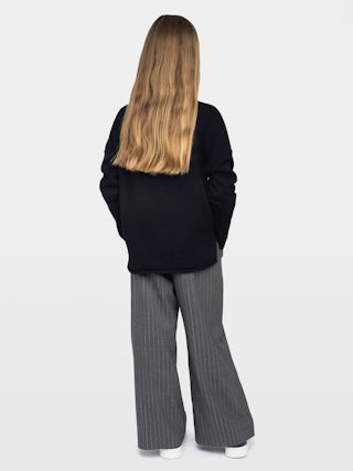 Almi Girl's Jumper - Wool jumper with high neck, loose fit, "Rock'n'Roll" embroidery on front, dropped shoulders.