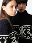 Christophe Cardigan - Long-sleeved navy blue thick knit zip-up cardigan with funnel collar and signature intarsia and arrows.
