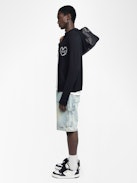 Cardigan Clash - Hooded cardigan with zip fastening and heart embroidery on the front.