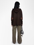 Cardigan Cosya - Hooded cardigan with western patch at elbows.