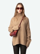 Alma Sweater - Long, loose-fitting sweater in brown knit with funnel neck, twists, embroidery on the sides and wing motifs on the back.