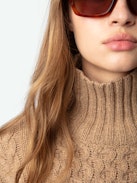 Alma Sweater - Long, loose-fitting sweater in brown knit with funnel neck, twists, embroidery on the sides and wing motifs on the back.