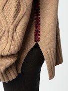 Alma Sweater - Long, loose-fitting sweater in brown knit with funnel neck, twists, embroidery on the sides and wing motifs on the back.