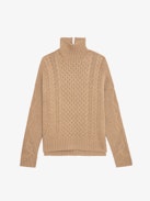 Alma Sweater - Long, loose-fitting sweater in brown knit with funnel neck, twists, embroidery on the sides and wing motifs on the back.