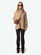 Alma Sweater - Long, loose-fitting sweater in brown knit with funnel neck, twists, embroidery on the sides and wing motifs on the back.