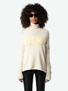 Pull Almy 100% Laine Merinos - Pull ample long en 100% laine mérinos jaune claire à col montant et message "Peace" en tweed contrasté.