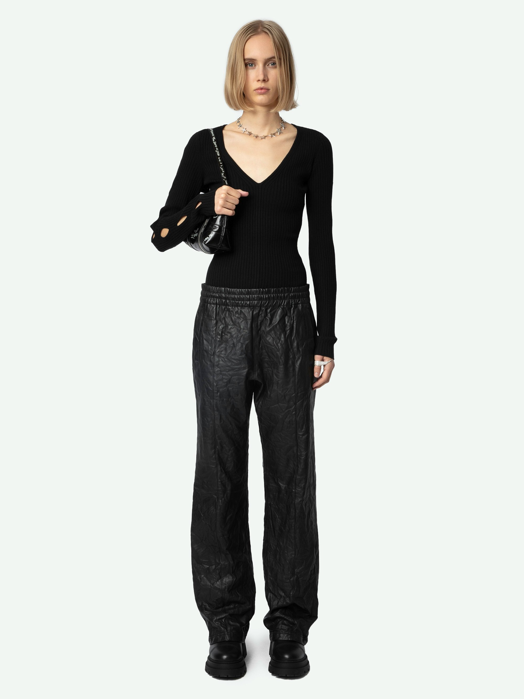 Syla Jumper - Black merino wool V-neck jumper with long sleeves and graphic openwork cut-outs.