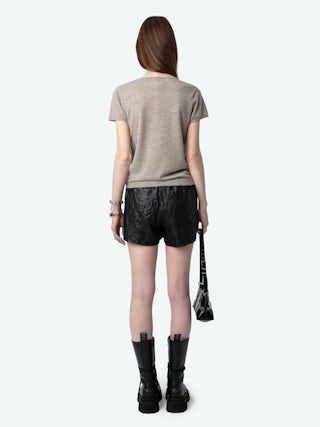 Jumper Celsy 100% Cashmere - Tunisian jumper with short sleeves, wing embroidery on the back and worn-effect edges.