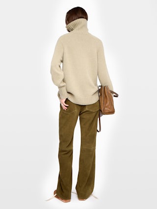 Mora Side Button Sweater - High-neck sweater with buttoned collar opening.
