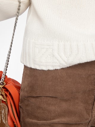 Nalma Cashmere Sweater - Sweater with roll neck and jewel button.