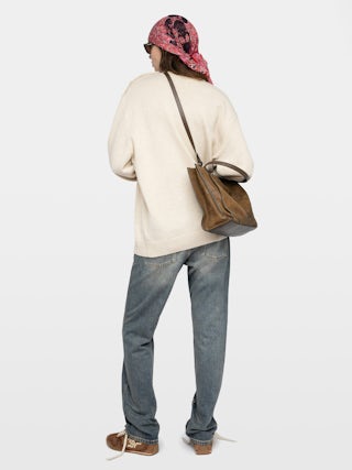 Swyna Sweater - Oversized round neck sweater with jeweled buttons.