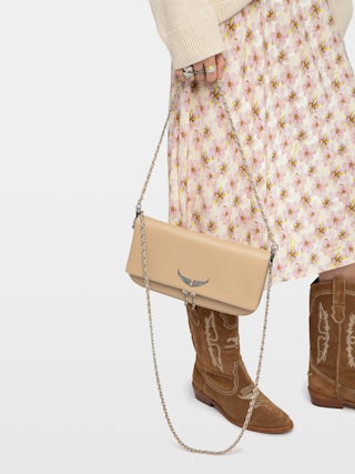 Rock Clutch - Grained leather clutch with double leather and metal chains and wings adorned with rhinestones.