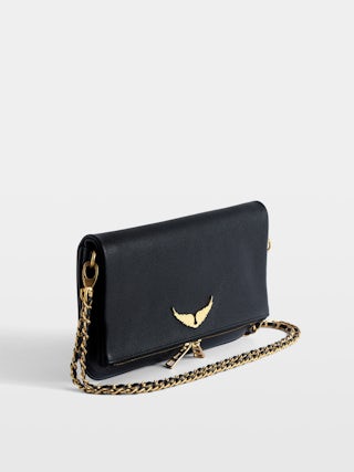 Pochette Rock - Pochette en cuir grainé à double chaînes cuir et métal et ailes ornées de strass.