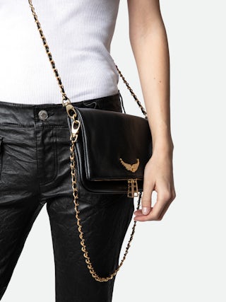 Rock Clutch - Grained leather clutch with double leather and metal chains and rhinestone-adorned wings.